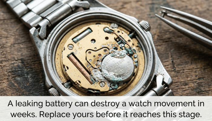 Corroded watch battery showing chemical leak damage